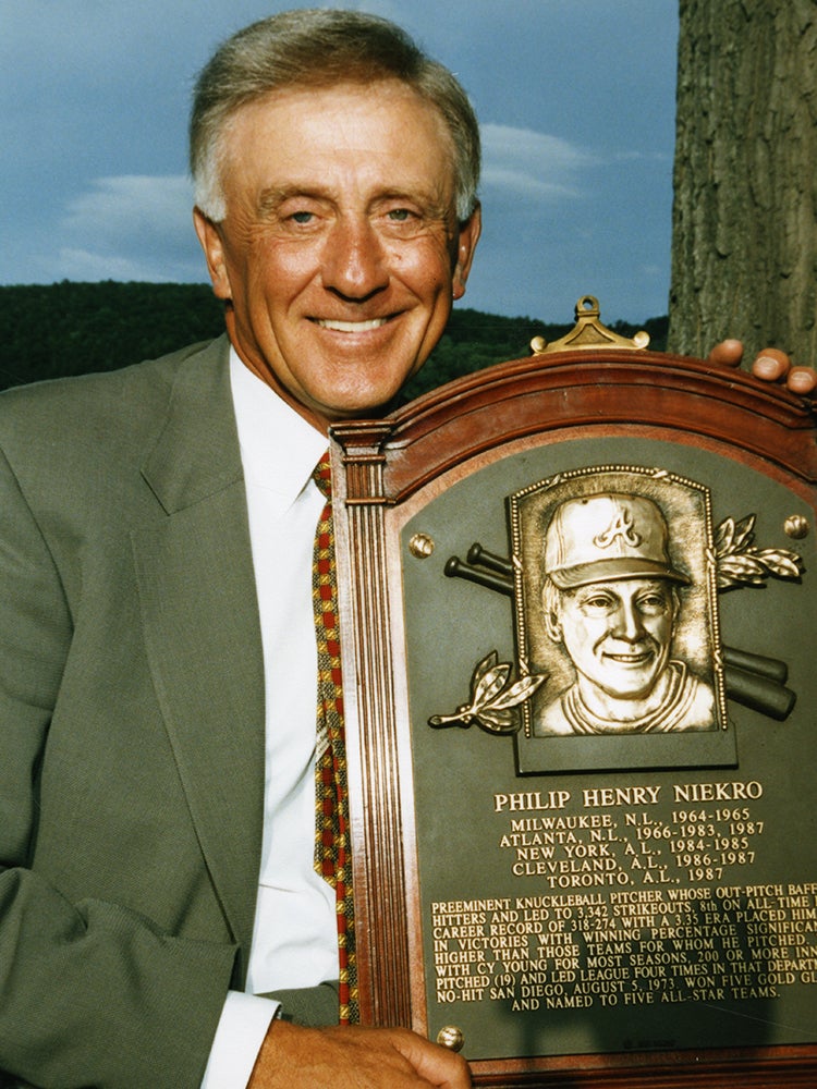 Phil Niekro holding Hall of Fame plaque